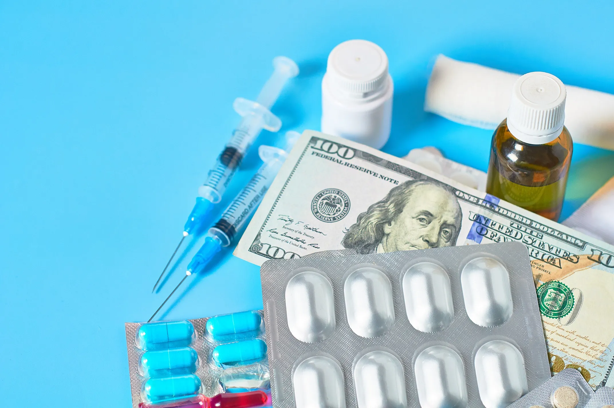 A pile of medication and money to imply fraud.
